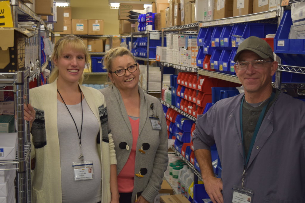 pharmacists smiling while posing for camera