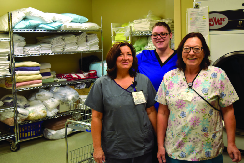 nurses standing in a hallway
