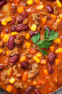 Traditional mexican dish chili con carne with minced meat and re
